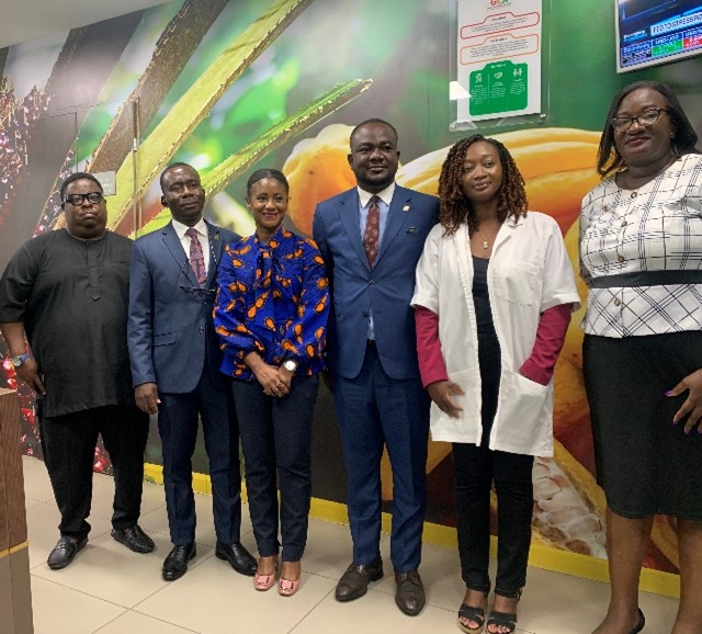 A group of people posing for a photoDescxxxription automatically generated