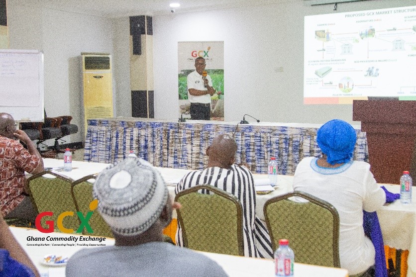 A person giving a presentation to a group of peopleDescxxxription automatically generated with medium confidence